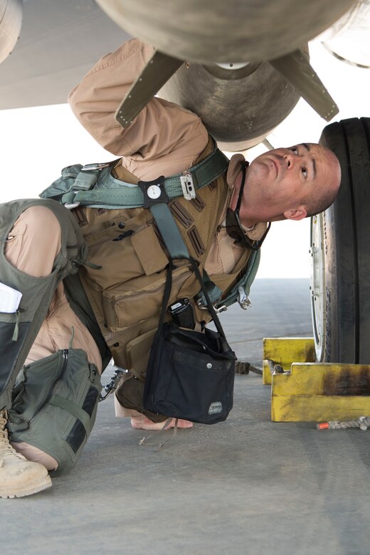 Col. William Marshall, 332nd Expeditionary Operations Group commander, performs pre-flight checks on an F-15E Strike Eagle, June 2, 2018, at an undisclosed location in Southwest Asia.