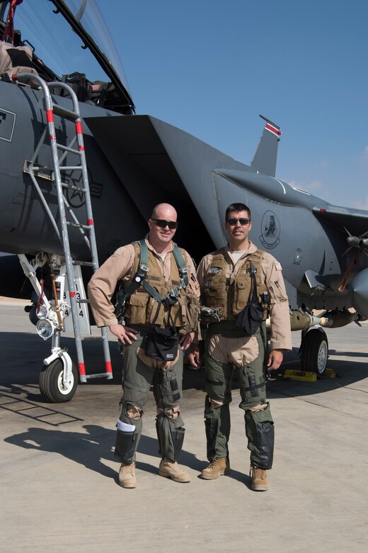 Col. William Marshall, 332nd Expeditionary Operations Group commander, and Col. Richard Goodman, 332nd Air Expeditionary Wing vice commander, stand in front of an F-15E Strike Eagle, June 2, 2018, at an undisclosed location in Southwest Asia.