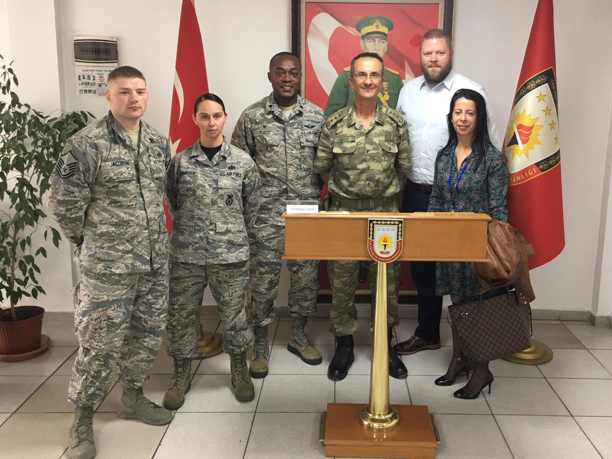 U.S. Air Force members of the 717th Air Base Squadron pose for a photo with the Turkish Education and Doctrine Base Mission Support Group commander after a joint security exercise at Ankara, Turkey, June 1, 2018.