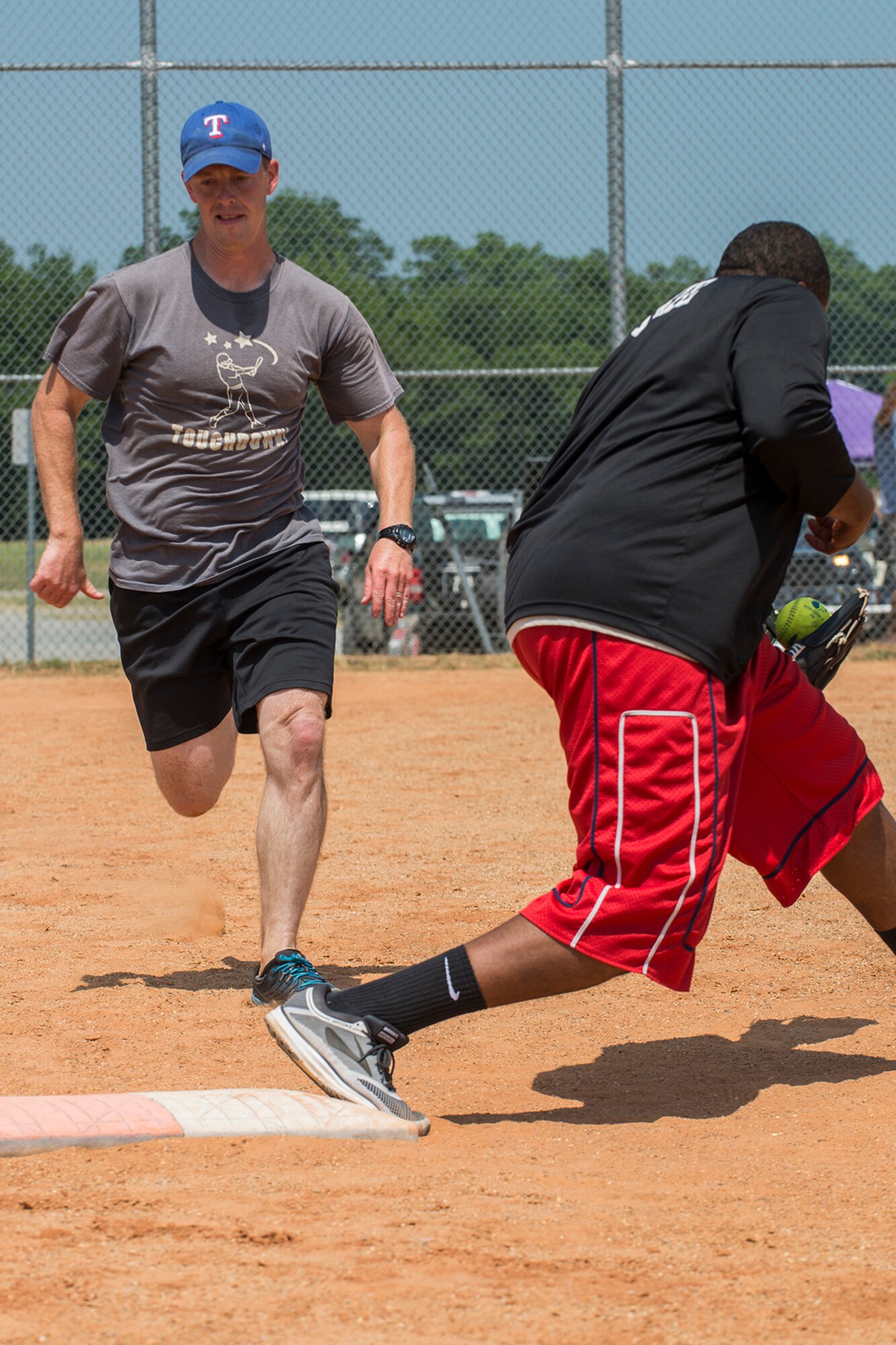 An Airmen didn’t beat the throw and is out at first base during a softball game between Airmen assigned to the 307th Maintenance Squadron on June 2, 2018, Barksdale AFB, La. Airmen from the muntions sections beat their counterparts from maintenance 14-5. (U.S. Air Force photo by Master Sgt. Greg Steele/Released)