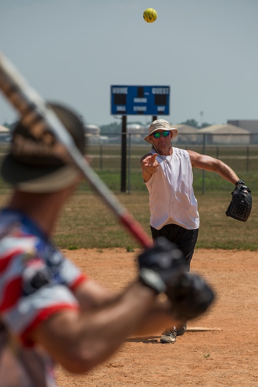 U.S. Air Force Chief Master Sgt. Kyle Graff throws a pitch to a member of the 307th Maintenance Squadron munitions section during a squadron softball game on June 2, 2018, Barksdale AFB, La. The game pitted munitions against maintainers, with munitions winning 14-5. (U.S. Air Force photo by Master Sgt. Greg Steele/Released)