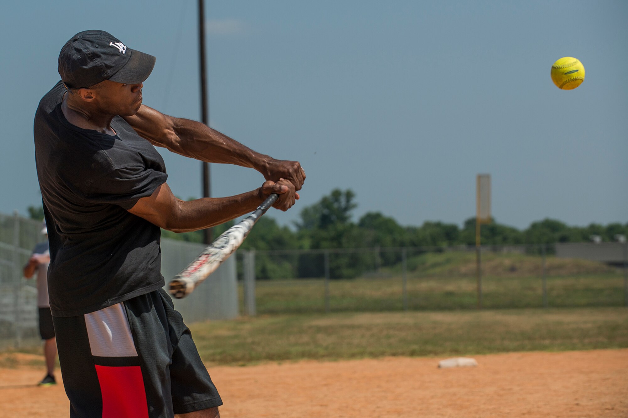 An Airman assigned to the 307th Maintnance Squadron is about to connect with a softball during a game held on June 2, 2018, Barksdale AFB, La. The game saw the munitions section battle against the maintenance section, with munitions winning 14-5. (U.S. Air Force photo by Master Sgt. Greg Steele/Released)