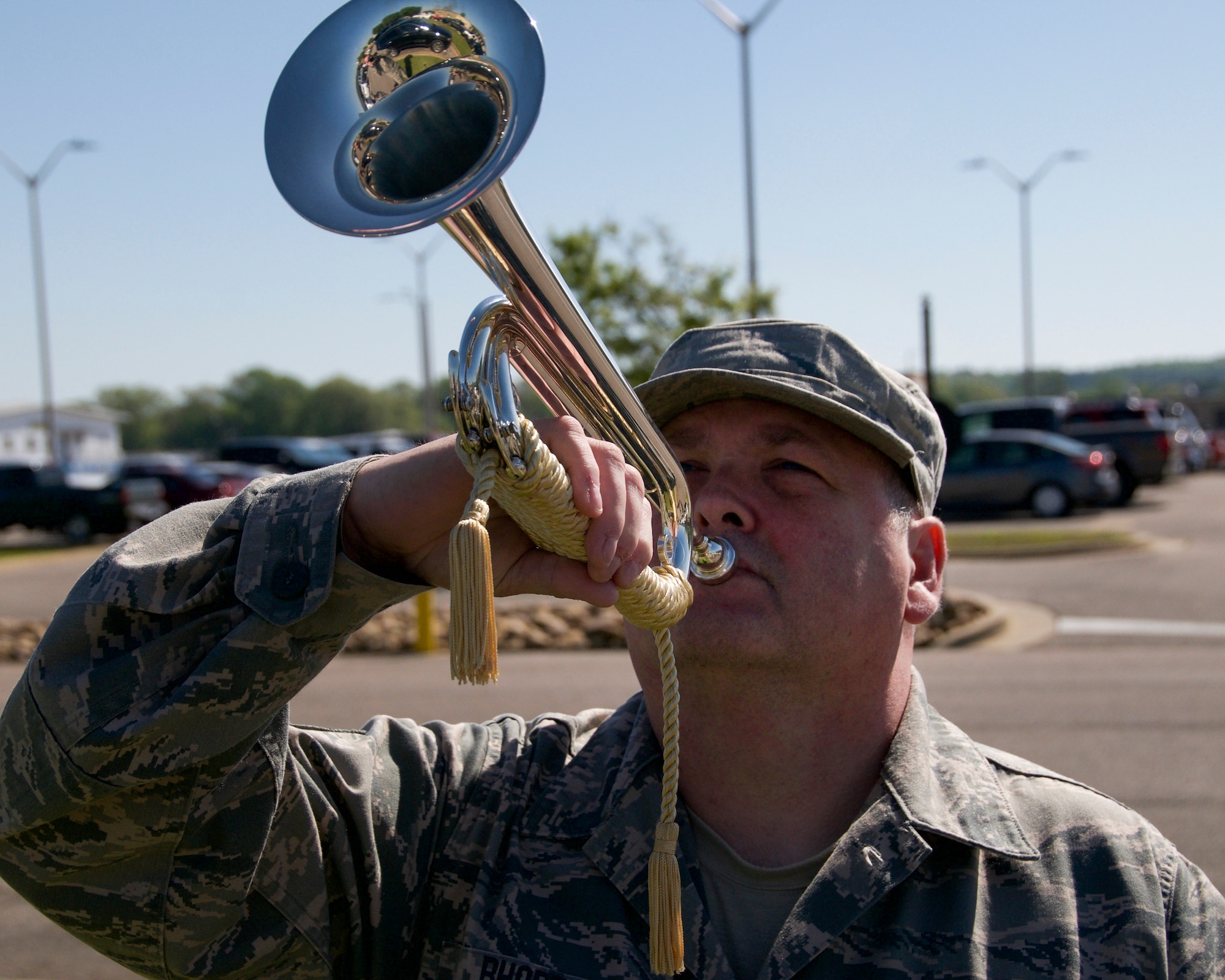 Tech. Sgt. John Rhoden, a functional assistant manager with the 186th Logistics Readiness Squadron, demonstrates how to play a bugle at Key Field Air National Guard Base, Meridian, Miss., April 8, 2018.