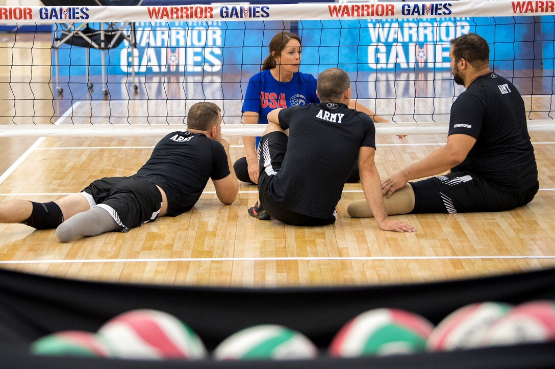 USA Volleyball and Team Army Coach Linda Gomez gives instructions to members of her team during practice for the 2018 Defense Department Warrior Games at the U.S. Air Force Academy in Colorado Springs, Colo., June 1, 2018. DoD photo by EJ Hersom