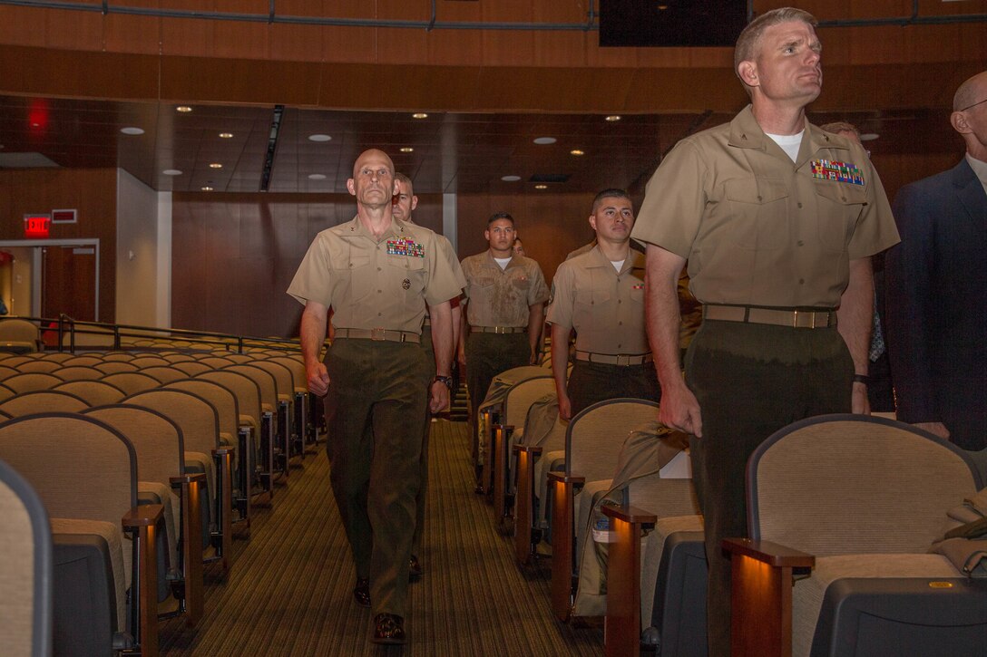 U.S. Marines with the official party of the Training Command change of command at Warner Hall, Marine Corps Base Quantico, Va., May 18, 2018. Brig. Gen. Jason Q. Bohm, outgoing commanding general (CG), Training Command, relinquished command to Col. Calvert Worth Jr., Brig. Gen. select, incoming CG, Training Command. (U.S. Marine Corps photo by Cpl. Brooke Deiters)
