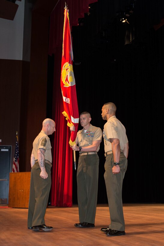 U.S. Marines Corps Brig. Gen. Jason Q. Bohm, outgoing commanding general (CG), Training Command, prepares to pass the colors to Col. Cal Worth Jr., Brig. Gen. select, incoming CG, Training Command, for the Training Command change of command at Warner Hall, Marine Corps Base Quantico, Va., May 18, 2018. Brig. Gen. Jason Q. Bohm, outgoing CG, Training Command, relinquished command to Col. Calvert Worth Jr., Brig. Gen. select, incoming CG, Training Command. (U.S. Marine Corps photo by Cpl. Brooke Deiters)