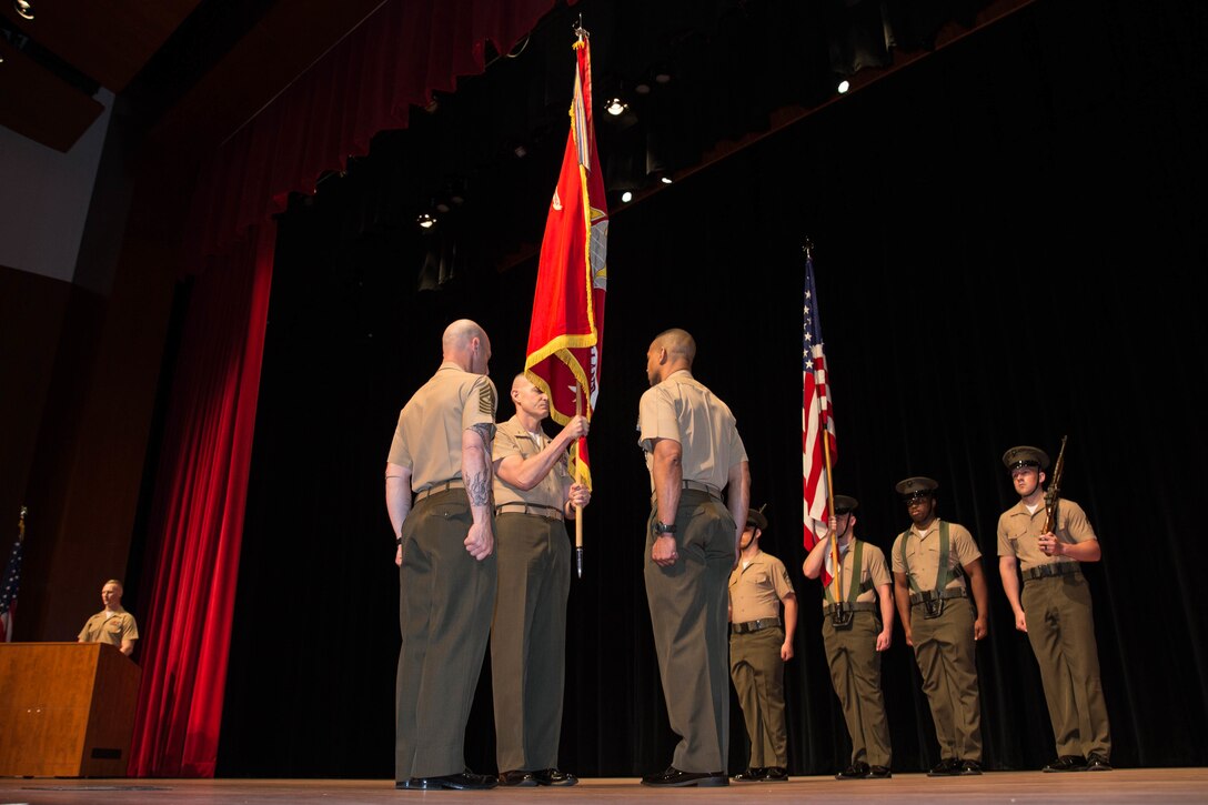 U.S. Marines Corps Brig. Gen. Jason Q. Bohm, outgoing commanding general (CG), Training Command, prepares to pass the colors to Col. Cal Worth Jr., Brig. Gen. select, incoming CG, Training Command, for the Training Command change of command at Warner Hall, Marine Corps Base Quantico, Va., May 18, 2018. Brig. Gen. Jason Q. Bohm, outgoing CG, Training Command, relinquished command to Col. Calvert Worth Jr., Brig. Gen. select, incoming CG, Training Command. (U.S. Marine Corps photo by Cpl. Brooke Deiters)