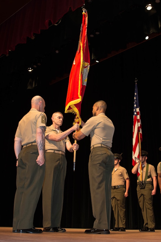 U.S. Marines Corps Brig. Gen. Jason Q. Bohm, outgoing commanding general (CG), Training Command, passes the colors to Col. Cal Worth Jr., Brig. Gen. select, incoming CG, Training Command, for the Training Command change of command at Warner Hall, Marine Corps Base Quantico, Va., May 18, 2018. Brig. Gen. Jason Q. Bohm, outgoing CG, Training Command, relinquished command to Col. Calvert Worth Jr., Brig. Gen. select, incoming CG, Training Command. (U.S. Marine Corps photo by Cpl. Brooke Deiters