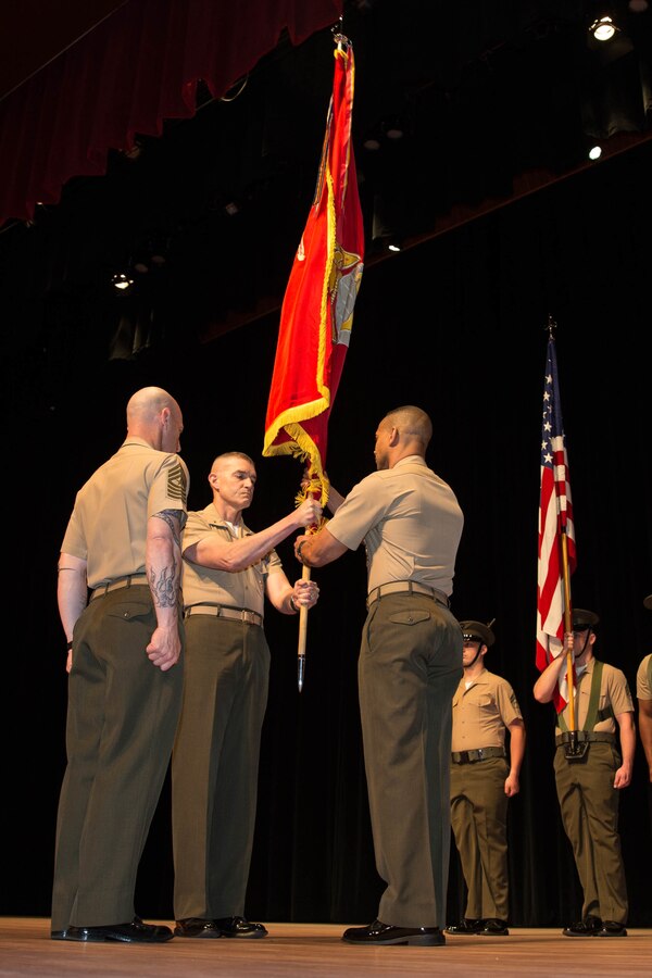 U.S. Marines Corps Brig. Gen. Jason Q. Bohm, outgoing commanding general (CG), Training Command, passes the colors to Col. Cal Worth Jr., Brig. Gen. select, incoming CG, Training Command, for the Training Command change of command at Warner Hall, Marine Corps Base Quantico, Va., May 18, 2018. Brig. Gen. Jason Q. Bohm, outgoing CG, Training Command, relinquished command to Col. Calvert Worth Jr., Brig. Gen. select, incoming CG, Training Command. (U.S. Marine Corps photo by Cpl. Brooke Deiters)