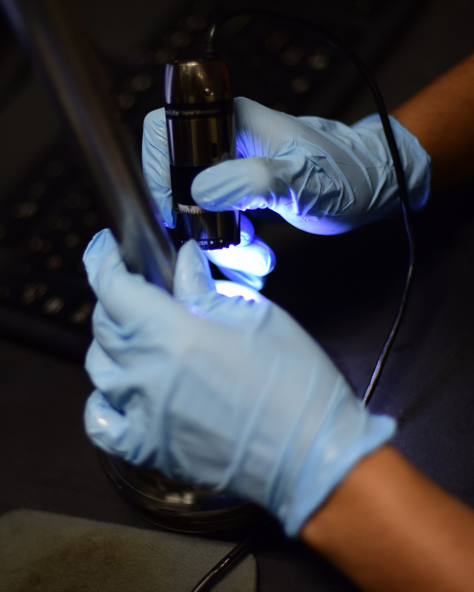 U.S. Air Force Airman Bryan Pham, 325th Maintenance Squadron nondestructive inspection specialist, inspects a metal component after finding a crack in it at Tyndall Air Force Base, Fla., May 1, 2018. Utilizing everything from x-rays to ultrasound, nondestructive inspection specialists find the smallest imperfections and take the corrective measures needed to keep Air Force equipment working safely. (U.S. Air Force photo by Senior Airman Cody R. Miller/Released)
