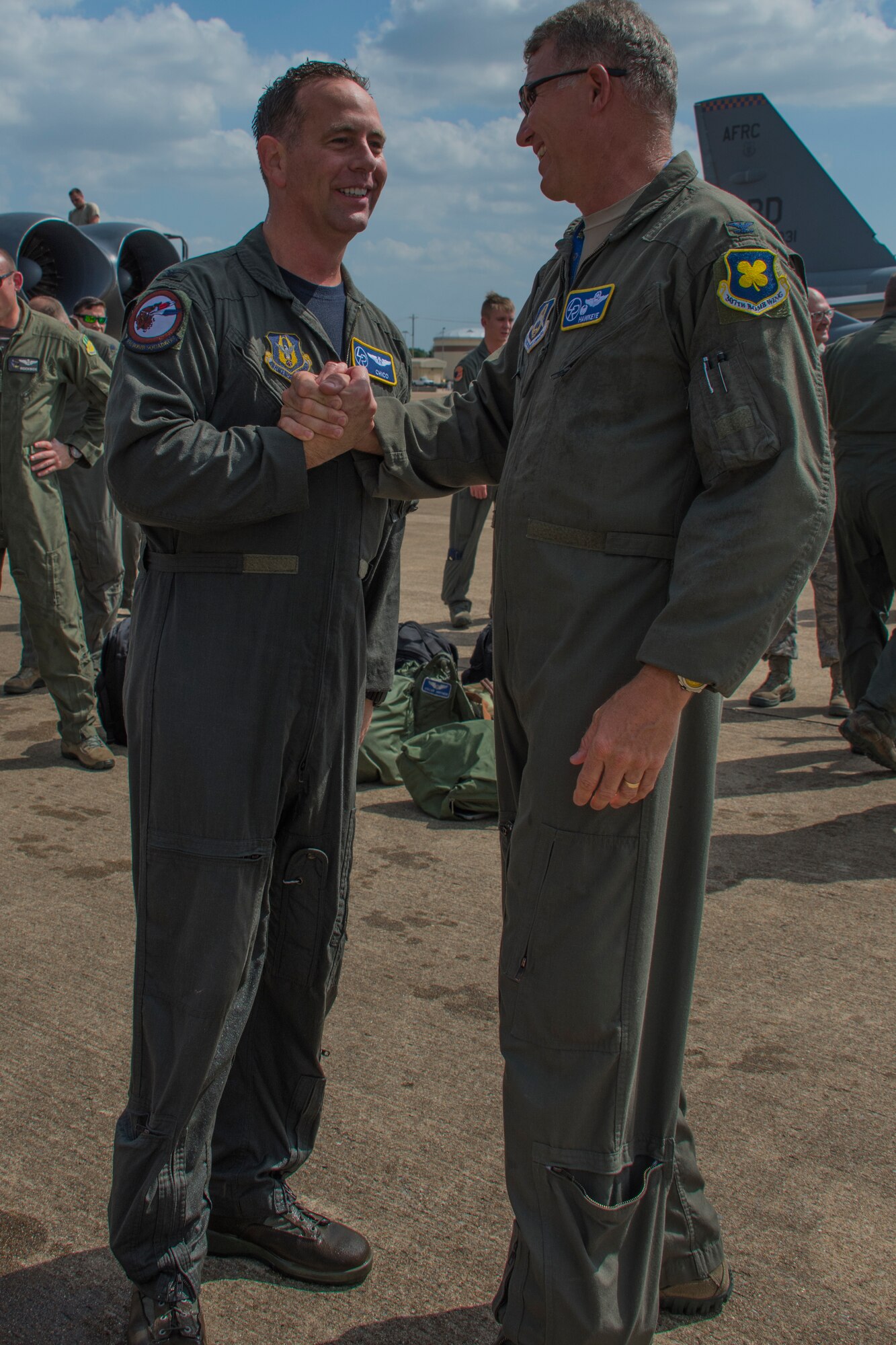 180601-F-AC305-2146
U.S. Air Force Col. Christopher Anderson, vice commander of the 307th Bomb Wing, shakes hands with Col. Robert Van Hoy, 307th BW commander, after Anderson completed his ‘fini flight’ at Barksdale Air Force Base, Louisiana, June 1, 2018. Anderson went on his last flight as part of the 307th Bomb Wing ahead of transferring to Offutt Air Force Base, Nebraska.(U.S. Air Force photo by Airman Maxwell Daigle/Released)