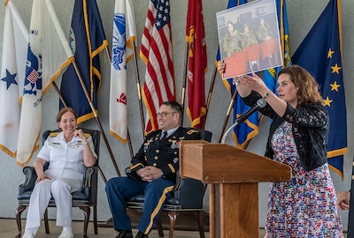 Kristen Farrand, wife of retiring Army Col. Dale Farrand, speaks at his retirement ceremony May 31