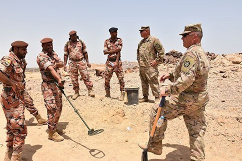 Maj. Brian Sayer, right, and Master Sgt. Rodney Haesemeyer, 35th Engineer Brigade, Task Force Spartan, discuss tactics, techniques and procedures of countering improvised explosive devices and praise the Omani soldiers on their excellent work on the practical exercise lanes.