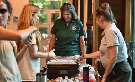Staff members from the Charles Town Landing Zoo serve refreshments during an Exceptional Family Member Program event June 1, 2018, at the Zoo.