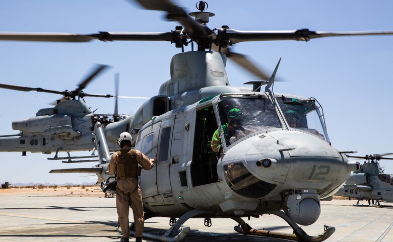 A crew with Light Attack Helicopter Squadron 367, also known as ‘Scarface', prepares a UH-1Y Venom Utility helicopter for a flight mission during the Final Exercise of Integrated Training Exercise 3-18 aboard the Marine Corps Air Ground Combat Center, Twentynine Palms, Calif., May 23, 2018. Marine aviation provides the Marines of the Marine Air Ground Task Force the operational flexibility it needs to accomplish their mission. (U.S. Marine Corps photo by Lance Cpl. Dave Flores)