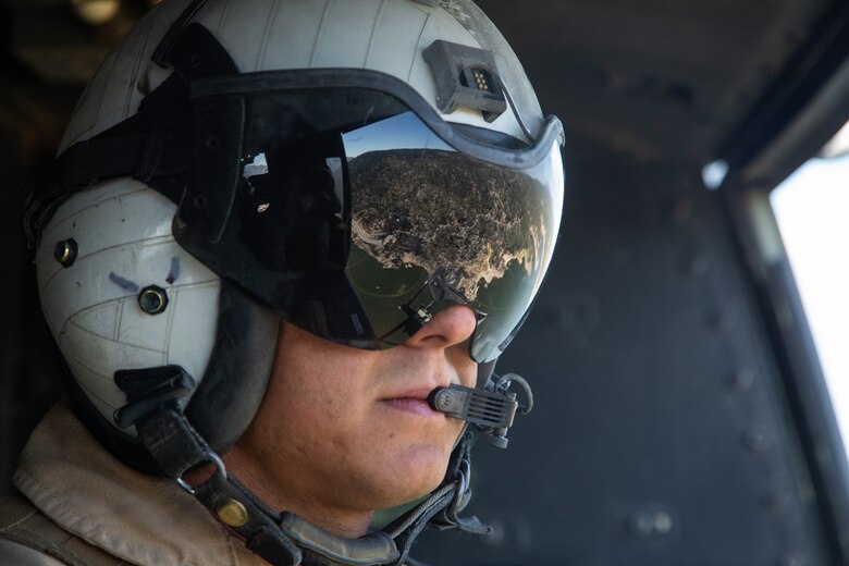 A doorgunner with Light Attack Helicopter Squadron 367, also known as ‘Scarface’, enjoys the view of Big Bear, Calif., while on a flight mission during the Final Exercise of Integrated Training Exercise 3-18 aboard the Marine Corps Air Ground Combat Center, Twentynine Palms, Calif., May 23, 2018. Marine aviation provides the Marines of the Marine Air Ground Task Force the operational flexibility it needs to accomplish their mission. (U.S. Marine Corps photo by Lance Cpl. Dave Flores)