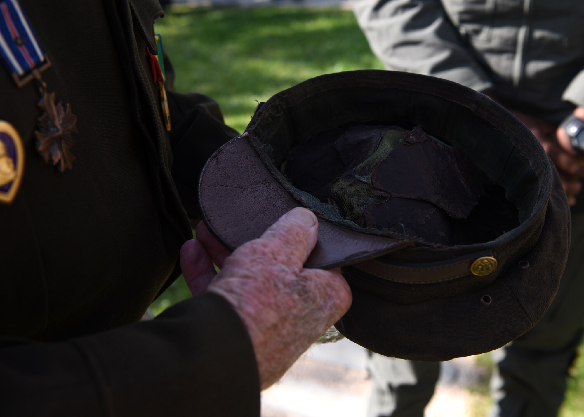 Original World War 2 hat being showed to U.S. Airmen