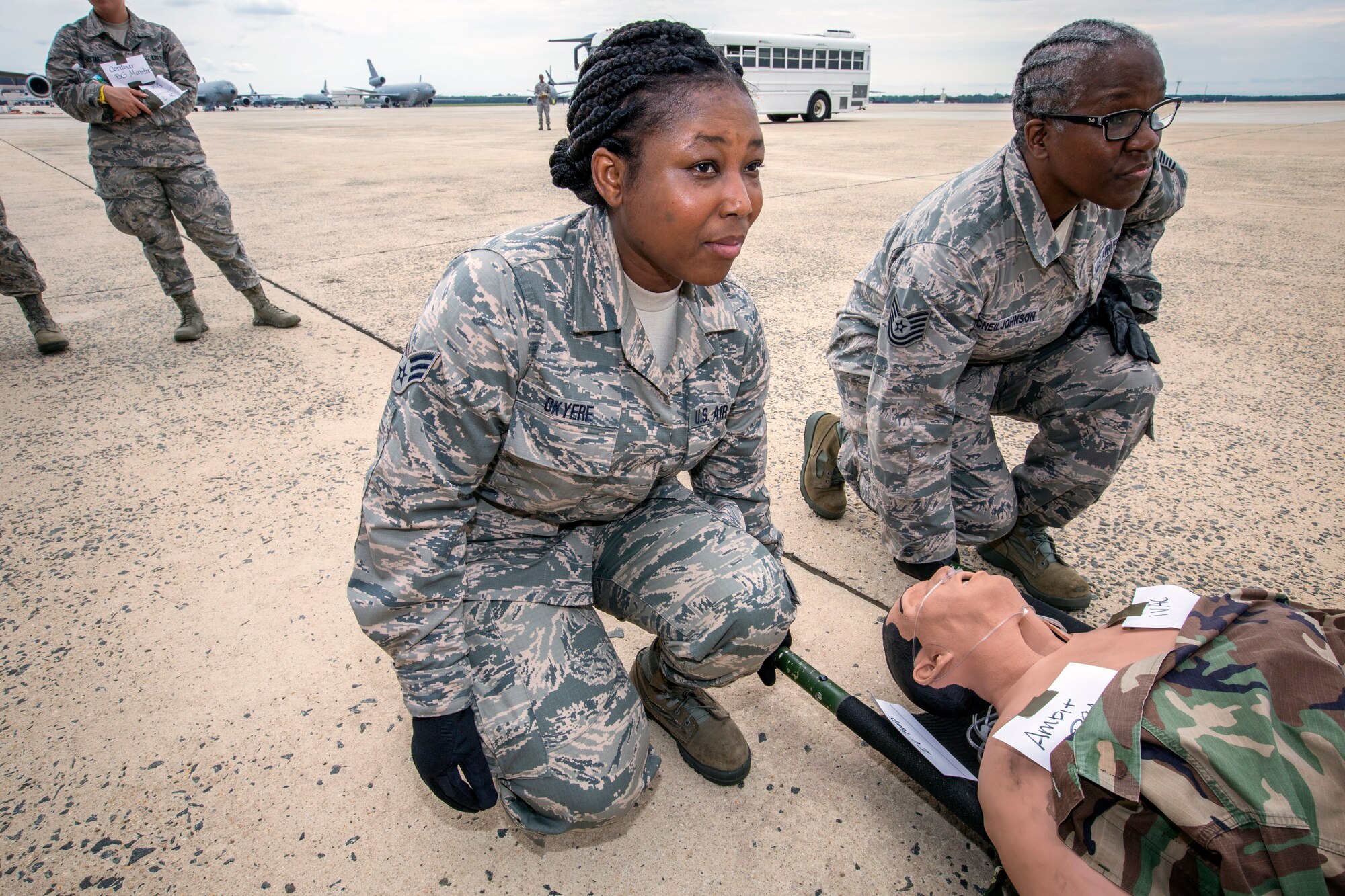U.S. Air Force Senior Airman Selina N. Okyere, center, and Staff Sgt. Sheran L. McNeil-Johnson, both with the 514th Aeromedical Evacuation Squadron, 514th Air Mobility Wing, participate in a patient loading exercise with 514th Aeromedical Evacuation and the 514th Aeromedical Staging Squadrons at Joint Base McGuire-Dix-Lakehurst, N.J., June 2, 2018. The 514th is an Air Force Reserve Command unit. (U.S. Air Force photo by Master Sgt. Mark C. Olsen)