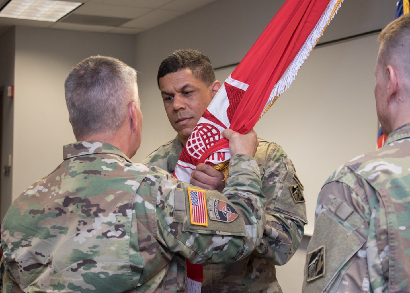 Lt. Gen. Todd T. Semonite passes the Transatlantic Division flag to Col. Mark C. Quander, incoming commander, thus charging him with command.