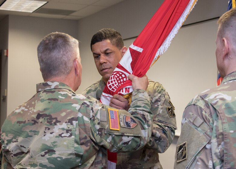 Lt. Gen. Todd T. Semonite passes the Transatlantic Division flag to Col. Mark C. Quander, incoming commander, thus charging him with command.