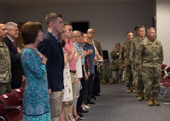 The official party and audience stand for the National Anthem during the Transatlantic Division change of command ceremony on May 22 in Winchester, Va.