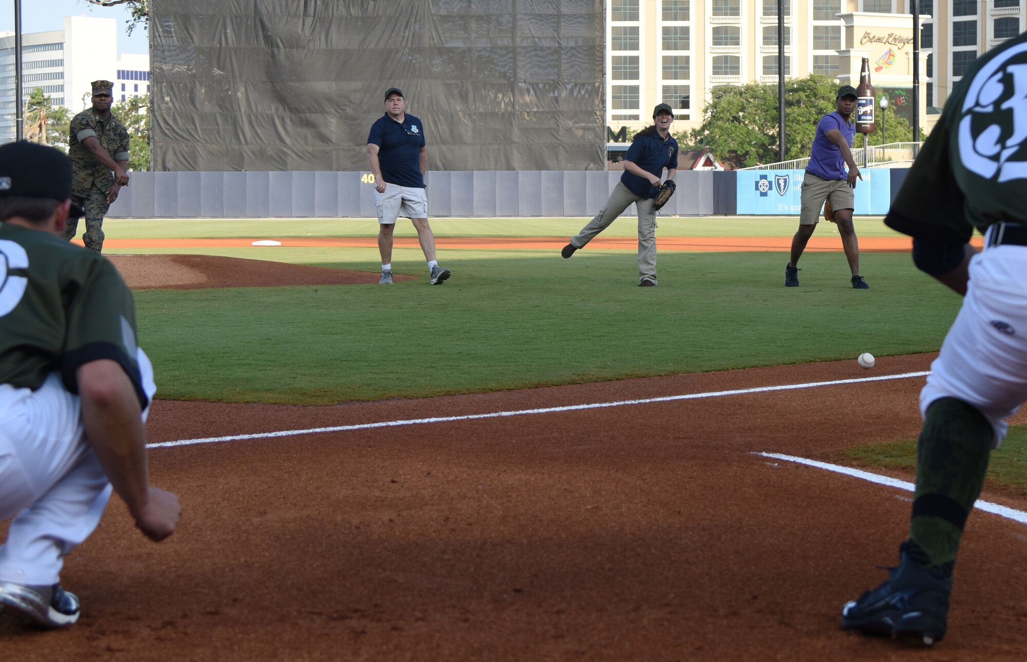 Keesler military members throw ceremonial first pitches during the Biloxi Shuckers Minor League Baseball team’s military appreciation night at MGM Park in Biloxi, Mississippi, June 2, 2018. Keesler Airmen and leadership also participated in pre-game festivities that included presenting the colors, flag display and throwing the ceremonial first pitches. (U.S. Air Force photo by Kemberly Groue)