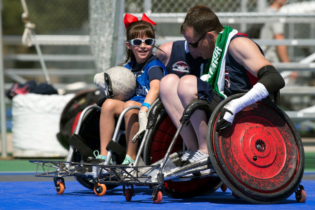 A child plays wheelchair rugby during an exhibition day.