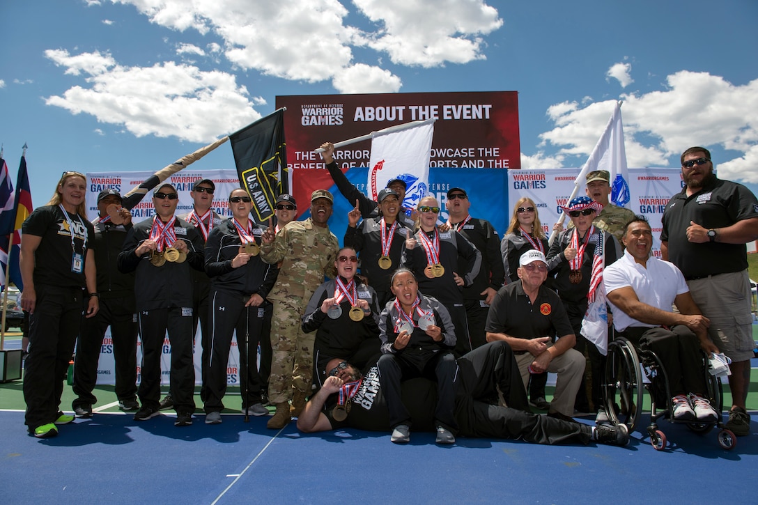 Team Army medalists gather for a photo after an awards ceremony