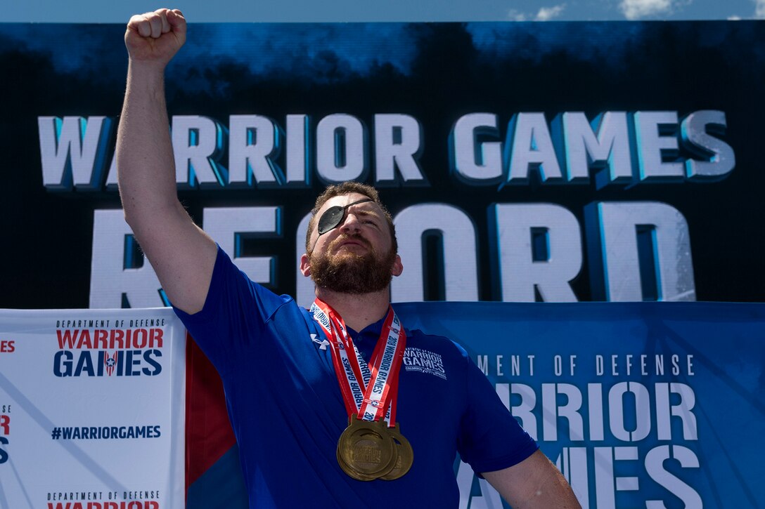 A service member reacts to being awarded a gold medal at the 2018 Warrior Games