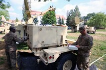 Soldiers working on generator