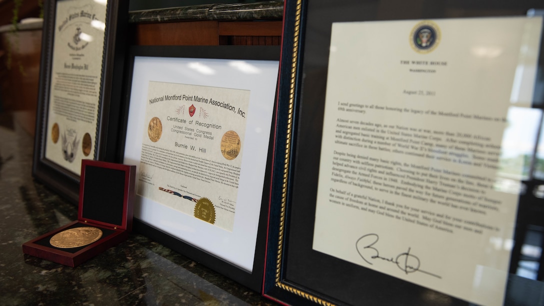 Pfc. Burnie W. Hill is posthumously honored with four awards during a Congressional Gold Medal Award Ceremony May 31, 2018 at MacDill Air Force Base, Florida. His son, Clement E. Hill, accepted the citations a behalf of his father, a Montford Point Marine. In 1942, African Americans were given the opportunity to enlist in the United States Marine Corps. Nearly 20,000 African Americans from 1942-1949 were trained separately from their white counterparts at Montford Point, a facility at Camp Lejeune, North Carolina.