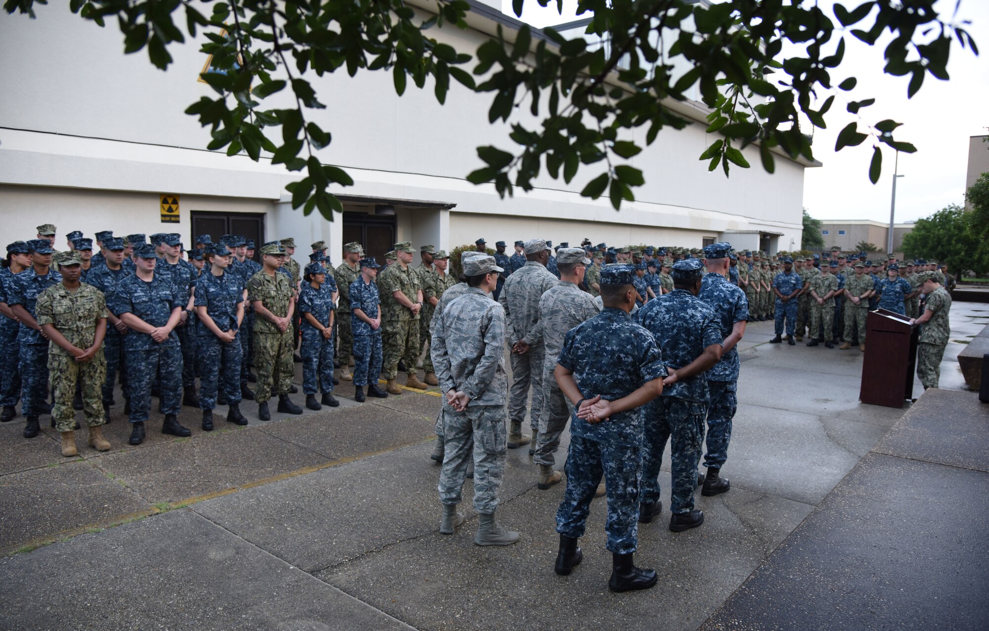 Keesler Airmen, Marines and Sailors stand in formation during the Battle of Midway Commemoration Ceremony hosted by the Center for Naval Aviation Technical Training Unit Keesler outside of Allee Hall at Keesler Air Force Base, Mississippi, June 5, 2018. The ceremony commemorated the 76th anniversary of the Battle of Midway, which was a U.S. naval victory during World War II. (U.S. Air Force photo by Kemberly Groue)