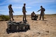 99th Civil Engineer Squadron explosive ordnance disposal technicians prepare a crate of flares for detonation during an ammunition disposition request at Nellis Air Force Base, Nevada, May 31, 2018. EOD technicians placed C4 around the crate to ensure every component was completely destroyed. (U.S. Air Force photo by Airman 1st Class Andrew D. Sarver)