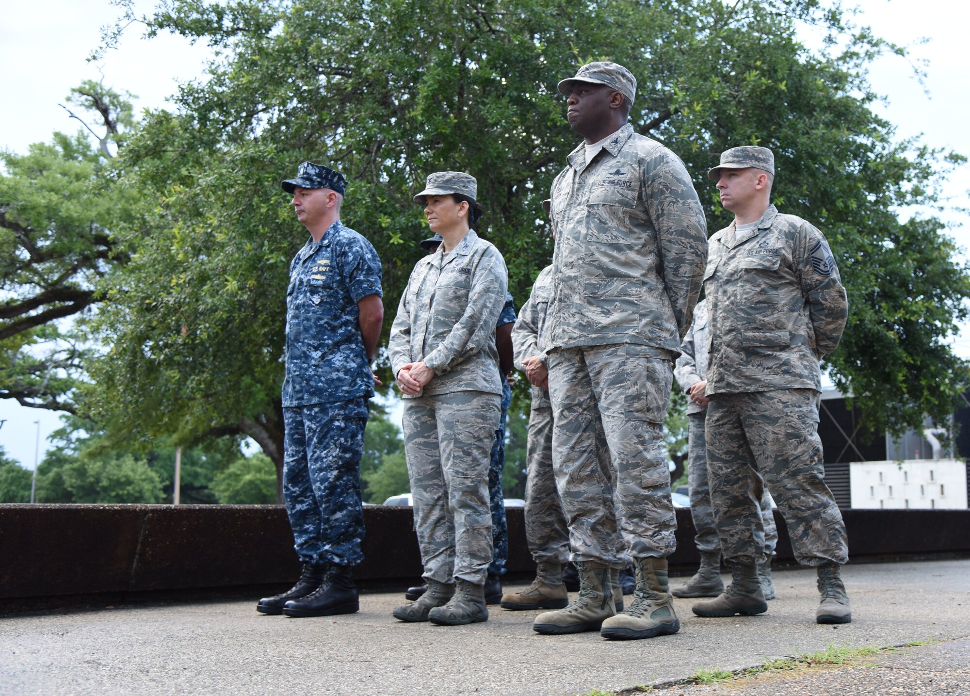Keesler Airmen and Sailors stand in formation during the Battle of Midway Commemoration Ceremony hosted by the Center for Naval Aviation Technical Training Unit Keesler outside of Allee Hall at Keesler Air Force Base, Mississippi, June 5, 2018. The ceremony commemorated the 76th anniversary of the Battle of Midway. (U.S. Air Force photo by Kemberly Groue)