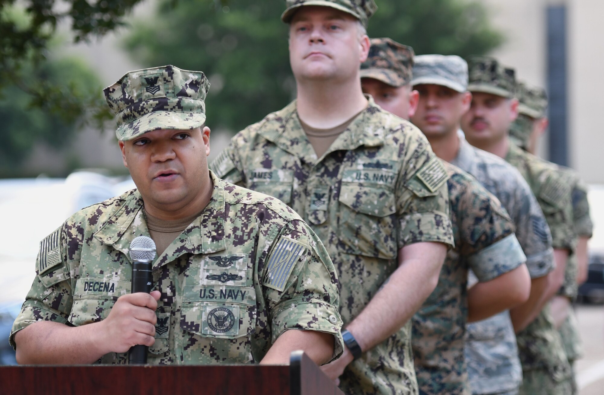 U.S. Navy Aviation Electronics Technician 1st Class Miguel Decena, Center for Naval Aviation Technical Training Unit Keesler advanced calibration lead, delivers remarks during the Battle of Midway Commemoration Ceremony hosted by the CNATTU Keesler outside of Allee Hall at Keesler Air Force Base, Mississippi, June 5, 2018. The ceremony commemorated the 76th anniversary of the Battle of Midway, which was a U.S. naval victory during World War II.  (U.S. Air Force photo by Kemberly Groue)