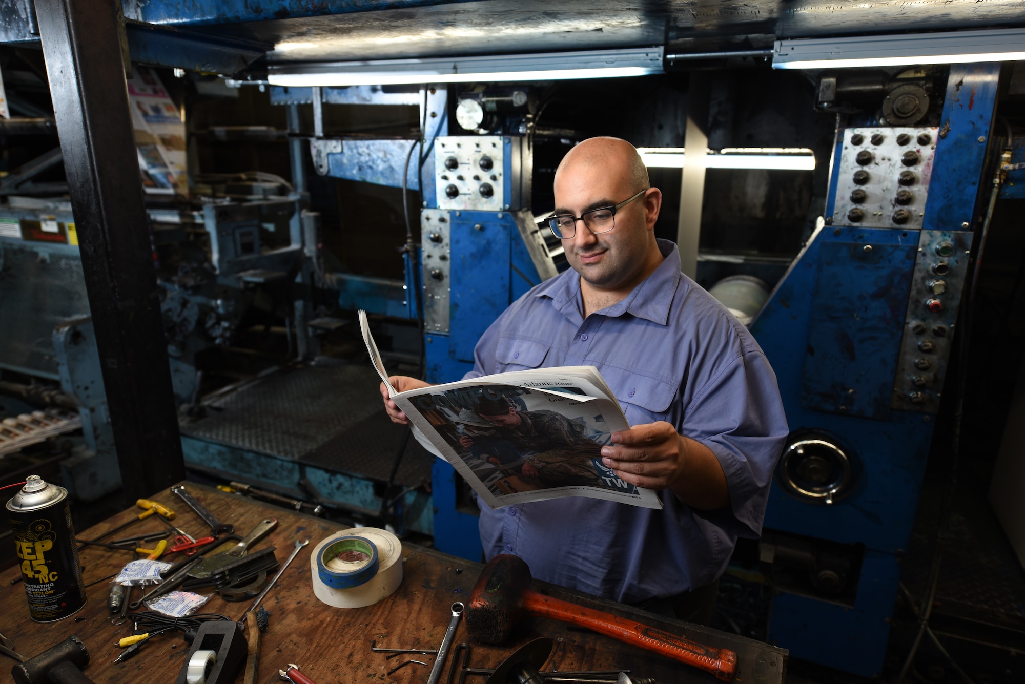 Nick DeCicco, Tailwind editor, poses for a photo May 4, 2018, at the Daily Republic Newspaper Office in Fairfield, Calif. DeCicco works at the Daily Republic, which houses the printing press where the Tailwind is printed. (U.S. Air Force photo by Staff Sgt. Amber Carter/Airman 1st Class Amy Younger)