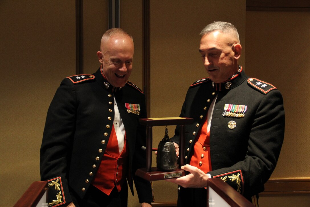 U.S. ARMY GARRISON YONGSAN – Maj. Gen. Patrick J. Hermesmann (left), commander of U.S. Marine Corps Forces Korea, presents a gift to the evening’s Guest of Honor Maj. Gen. James W. Lukeman (right), assistant chief of staff of Plans and Policy at United Nations Command, Combined Forces Command, and U.S. Forces Korea, at the MARFORK “Dining Out” here, June 2.  MARFORK conducted the formal military dinner to build comradery, remember the sacrifices of those who came before them, and celebrate their military service together. (U.S. Marine Corps photo by Sgt. Nathaniel Hanscom/Released)