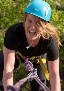Gwen Nieberlein, a 673d Medical Group Family Advocacy Outreach Manager, celebrates after reaching the top during an Outdoor Adventure Program rock-climbing trip at Pivot Point Trail near Anchorage, Alaska, May 31, 2018. Nieberlein has participated in many of OAP’s guided events since being stationed at Joint Base Elmendorf-Richardson. The OAP offers many opportunities year-round for the JBER community to explore Alaska while also supporting the development of mission-ready military families and members.