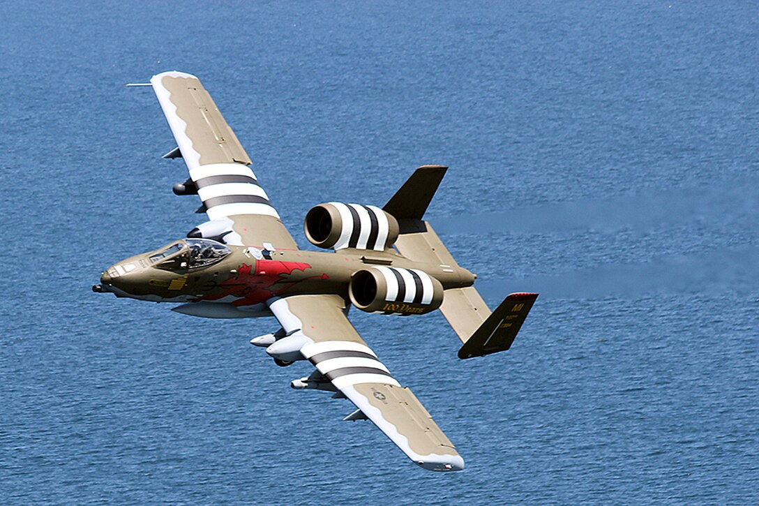 An A-10 Thunderbolt II aircraft from the 107th Fighter Squadron, Michigan Air National Guard, fly over the beaches of Normandy, France.