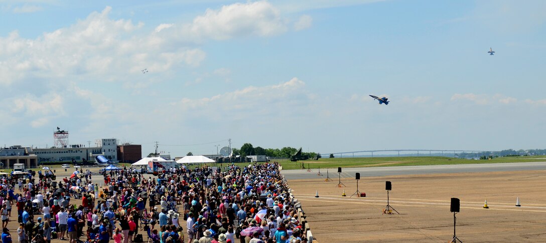 The Blue Angels perform a practice demonstration in front of spectators.