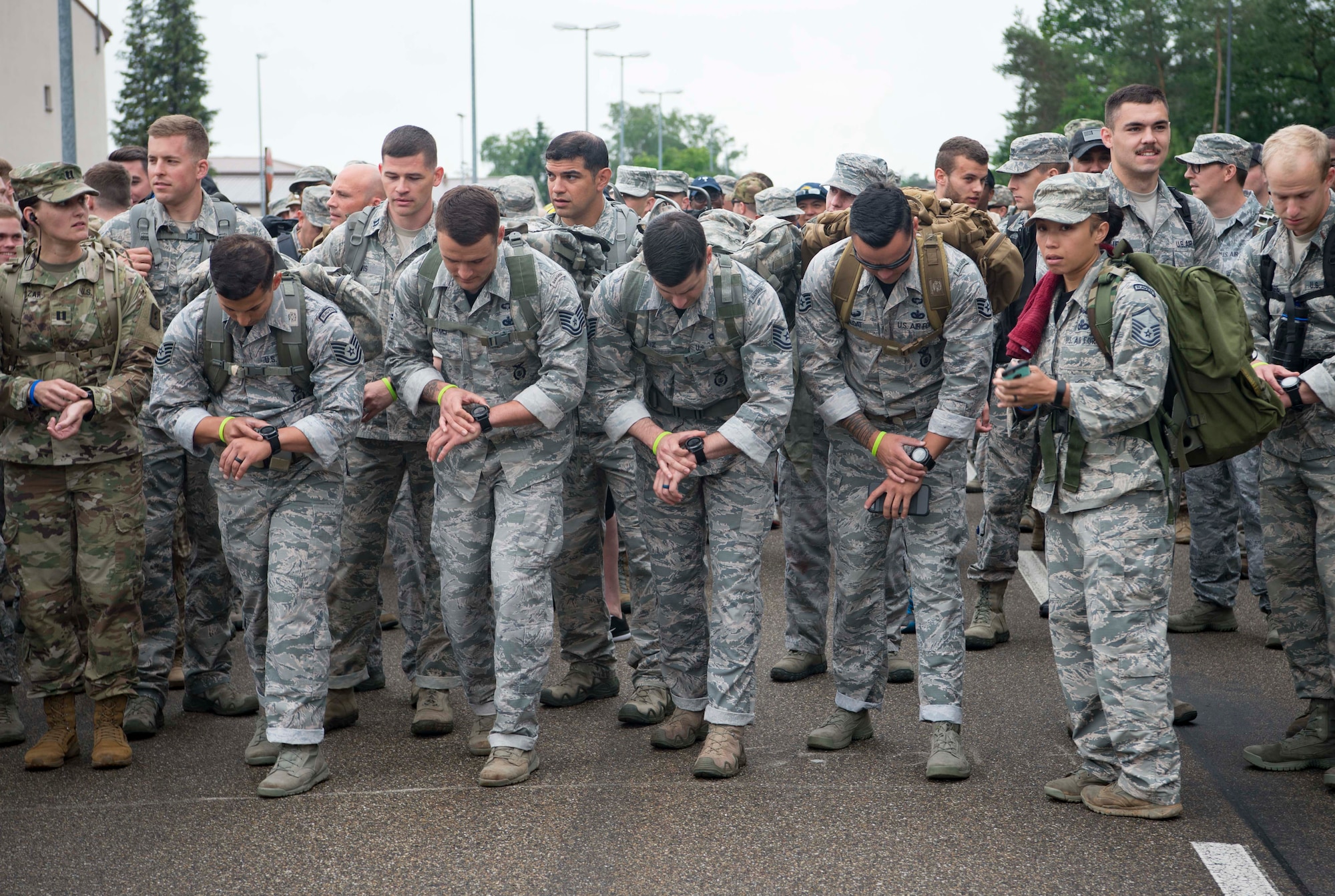 Kaiserslautern Military Community service members wait to begin a 10K ruck during the Third Annual Chief Master Sgt. of the Air Force Paul Airey Memorial Ruck/March/Run on Ramstein Air Base, Germany, June 1, 2018. More than 400 service members participated in the memorial events, which included a 5K and 10K run or walk and a 10K ruck with 1st, 2nd, and 3rd place prizes. (U.S. Air Force photo by Senior Airman Elizabeth Baker)