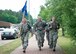 U.S. Airmen assigned to the 569th United States Forces Police Squadron run during the Third Annual Chief Master Sgt. of the Air Force Paul Airey Memorial Ruck/March/Run on Ramstein Air Base, Germany, June 1, 2018. Teams from various squadrons in the Kaiserslautern Military Community area took on the 10K ruck march challenge, in which participants were allowed to walk or run but they had to be in uniform and carry 25lb rucks, or backpacks, from start to finish. (U.S. Air Force photo by Senior Airman Elizabeth Baker)