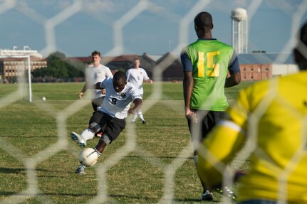 A member of the 633rd Medical Group team kicks the ball during the Intramural Soccer Championship at Joint Base Langley-Eustis, Virginia, June 4, 2018.
