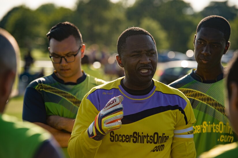 U.S. Air Force Staff Sgt. Elvis Eseh, 735th Supply Chain Operations Group team goalie, speaks to his team during the Intramural Soccer Championship at Joint Base Langley-Eustis, Virginia, June 4, 2018.