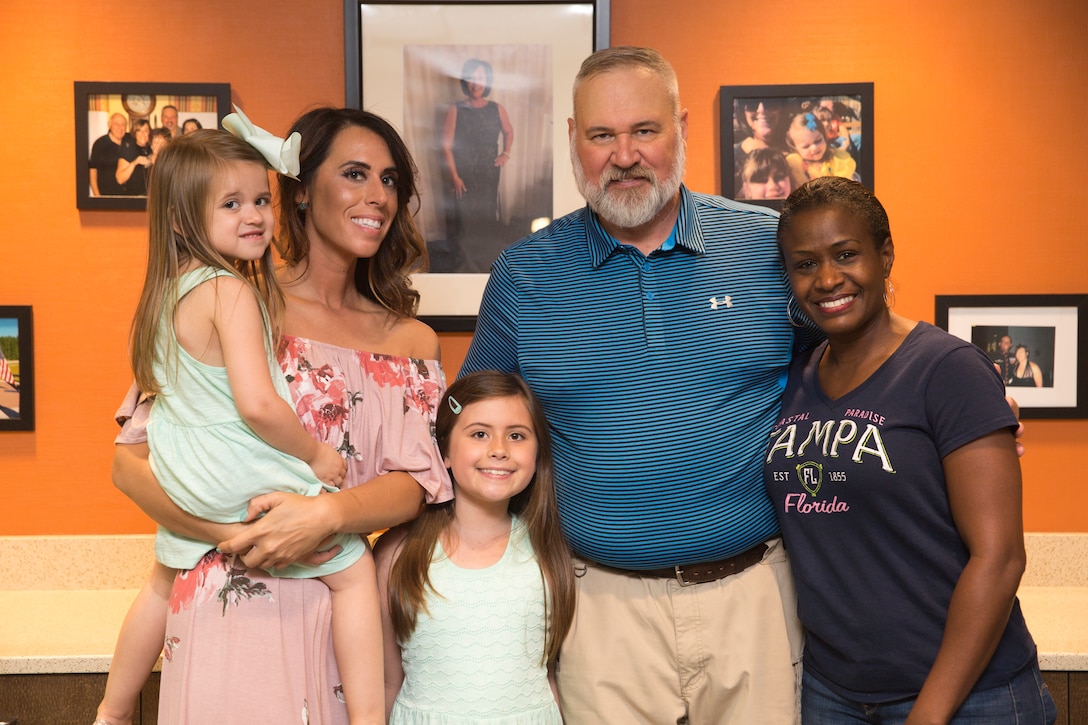 Members of the Weidow family and family friend Maj. Lechelle Rapallini, adjutant, Wounded Warrior Battalion – East, right, commemorate the dedication of a room within the WWBn-E facility to Linda “Lin” Weidow, a former medical advisor at WWBn-E, on Marine Corps Base Camp Lejeune, May 24