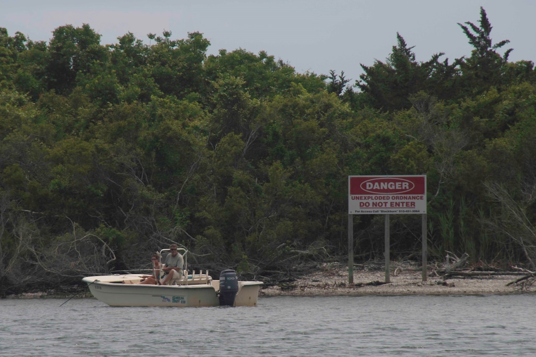 A couple sits illegally anchored in front of Browns Island in the Atlantic‐Intracoastal Waterway on May 25.