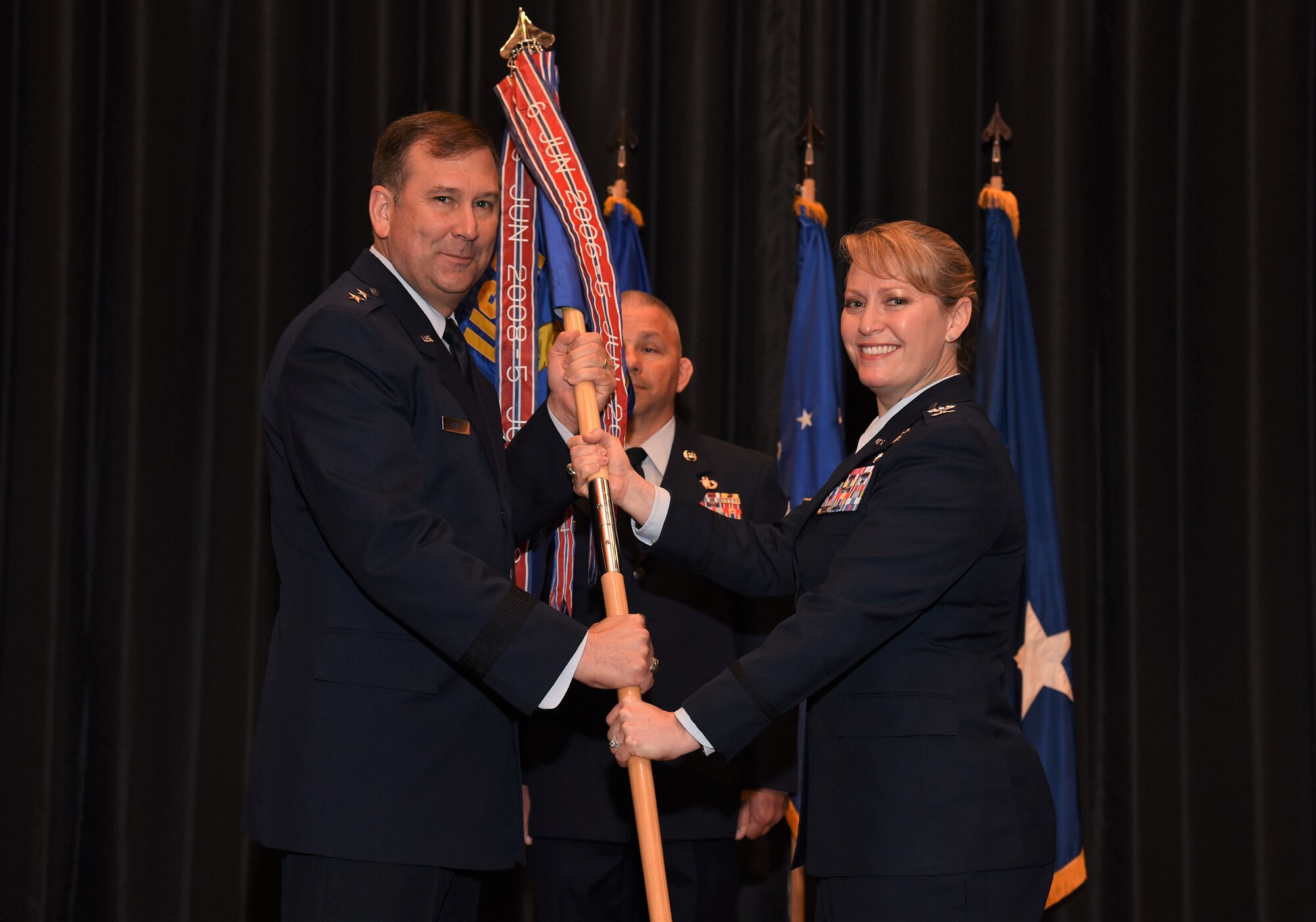 Col. Mona Alexander assumes command of the U.S. Air Force Expeditionary Operations School during a change of command ceremony held at Grace Patterson Hall at Joint Base McGuire-Dix-Lakehurst, June 5, 2018. (U.S. Air Force photo by Tech. Sgt. Jamie Powell)
