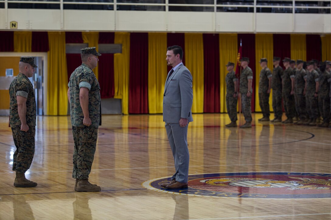 Sean-Paul Donovan, a former sergeant with 2nd Radio Battalion, II Marine Expeditionary Force Information Group is awarded the Navy and Marine Corps Medal at Camp Lejeune, N.C., May 17, 2018. The Navy and Marine Corps Medal is the highest non-combatant decoration awarded. Donovan received this award for saving the life of one of his fellow Marines. (U.S. Marine Corps photo by Lance Cpl. Tiana Boyd)