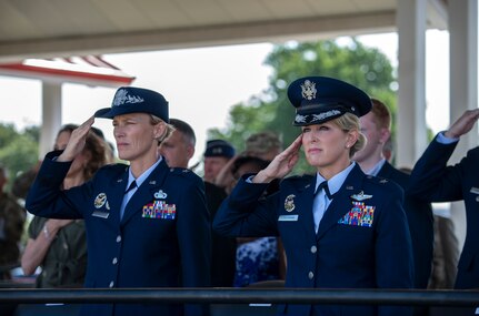 Brig. Gen. Heather Pringle, outgoing 502nd Air Base Wing and Joint Base San Antonio commander; and Brig. Gen. Laura L. Lenderman, incoming 502nd ABW and JBSA commander; salute during the change of command ceremony at JBSA-Fort Sam Houston’s MacArthur Parade Field June 6, 2018. The change of command ceremony represents the formal passing of responsibility, authority and accountability of command from one officer to another. Pringle served as commander since August 2016.