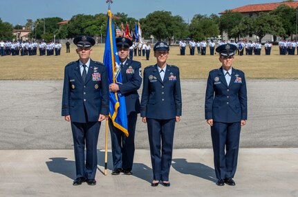 U.S Air Force Lt. Gen. Steve Kwast, commander of Air Education and Training Command and presiding official; Brig. Gen. Heather Pringle, outgoing 502nd Air Base Wing and Joint Base San Antonio commander; and Brig. Gen. Laura L. Lenderman, incoming 502nd ABW and JBSA commander; stand at attention during the change of command ceremony at JBSA-Fort Sam Houston’s MacArthur Parade Field June 6, 2018. The change of command ceremony represents the formal passing of responsibility, authority and accountability of command from one officer to another. Pringle served as commander since August 2016.